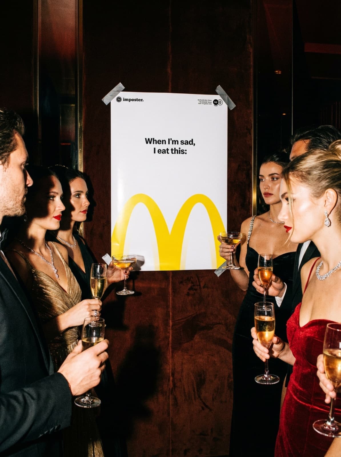 When I'm Sad, I Eat This taped up at a black-tie party